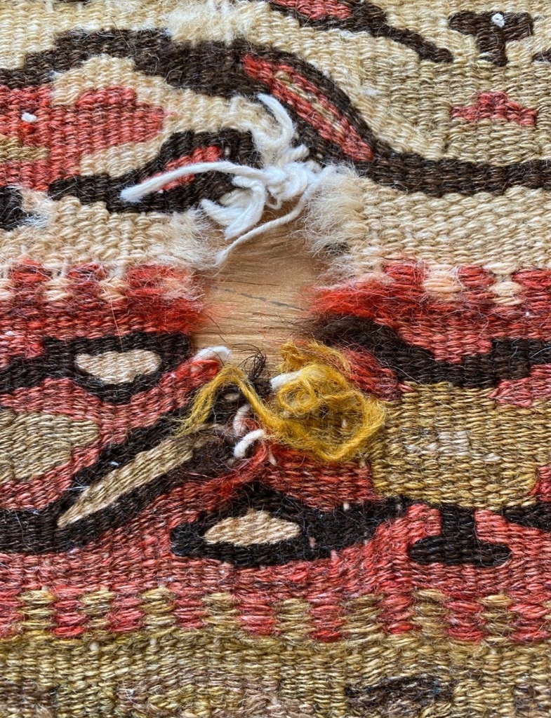 Damaged Kilim Hole Before Restoration